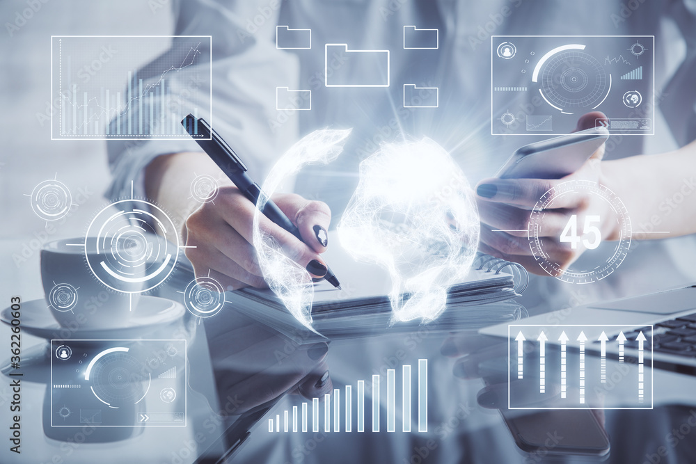 Double exposure of financial graph sketch hologram and woman holding and using a mobile device. Stock exchange concept. Double exposure of financial graph sketch hologram and woman holding and using a mobile device. Stock exchange concept.