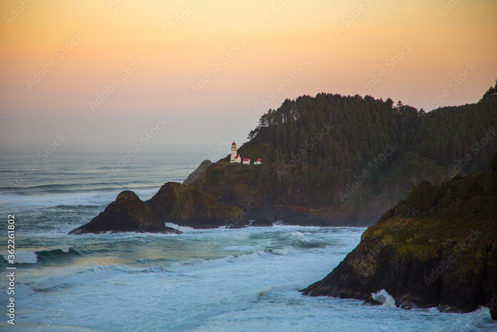 Heceta Head lighthouse at sunset on the southern Oregon coast near Florence.