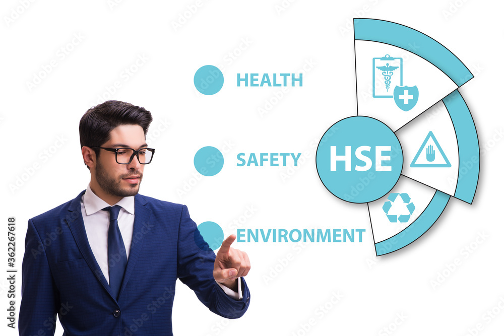 HSE concept with businessman pressing virtual button HSE concept with businessman pressing virtual button