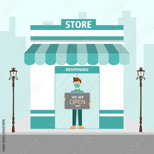 Small business owner wearing face mask holding sign now we are open again. support local business reopening shop concept. coronavirus covid-19 prevention in new normal