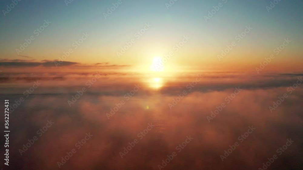 Clouds Moving Above The Sea With A Sunset In The Background In South iceland - Aerial Drone shot Clouds Moving Above The Sea With A Sunset In The Background In South iceland - Aerial Drone shot