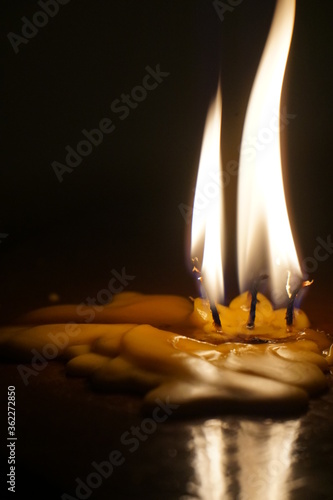 The yellow candles with black background © Gigi