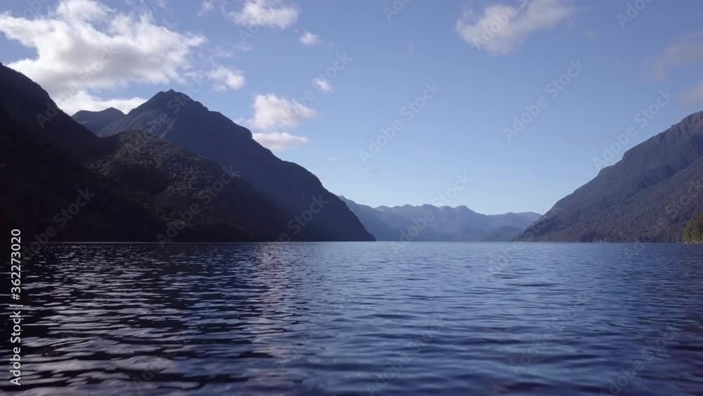 Low aerial over lake in New Zealand mountains dramatic Low aerial over lake in New Zealand mountains dramatic