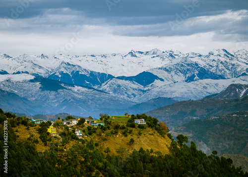 A scenic village in the backdrop of the Himalayan mountains. Himachal Pradesh, India.