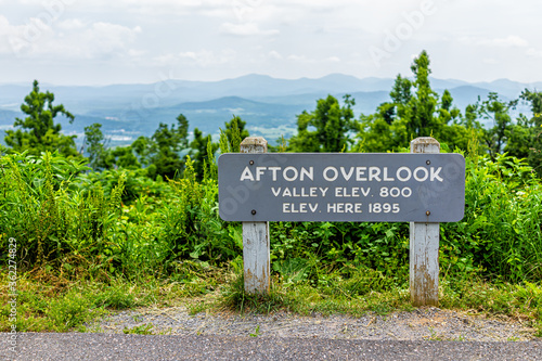 Overlook sign for Afton valley and elevation at Blue Ridge parkway appalachian mountains in summer with nobody and scenic lush foliage