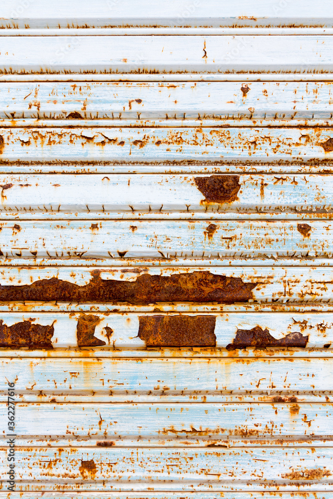Close-up metallic pattern of rusty gate