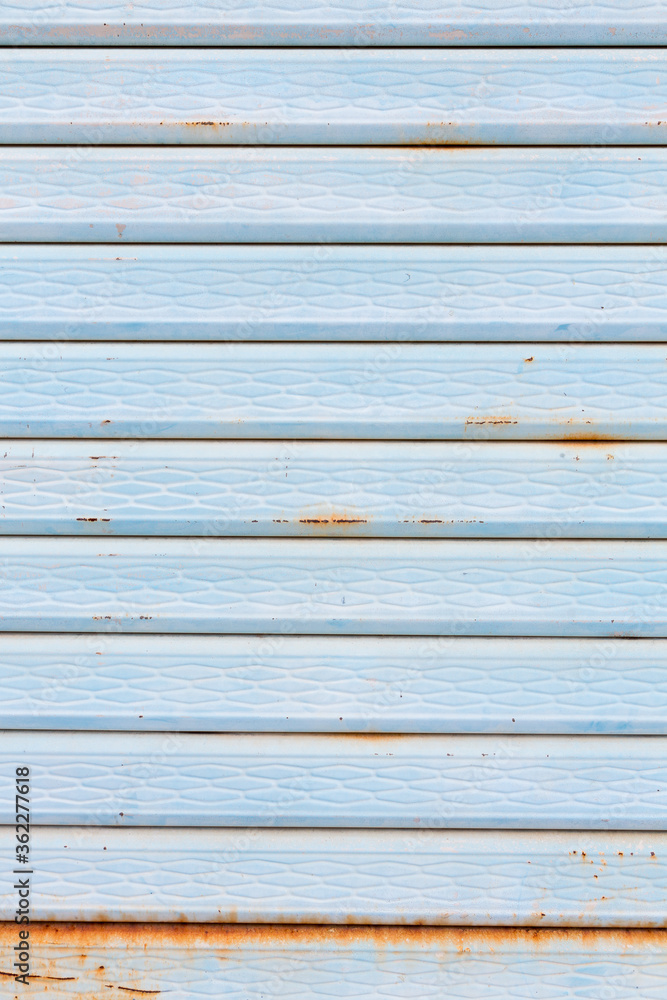 Close-up metallic pattern of rusty gate