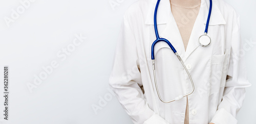 Medicine doctor woman in white coat with stethoscope. Healthcare and medical concept. Banner with copy space.