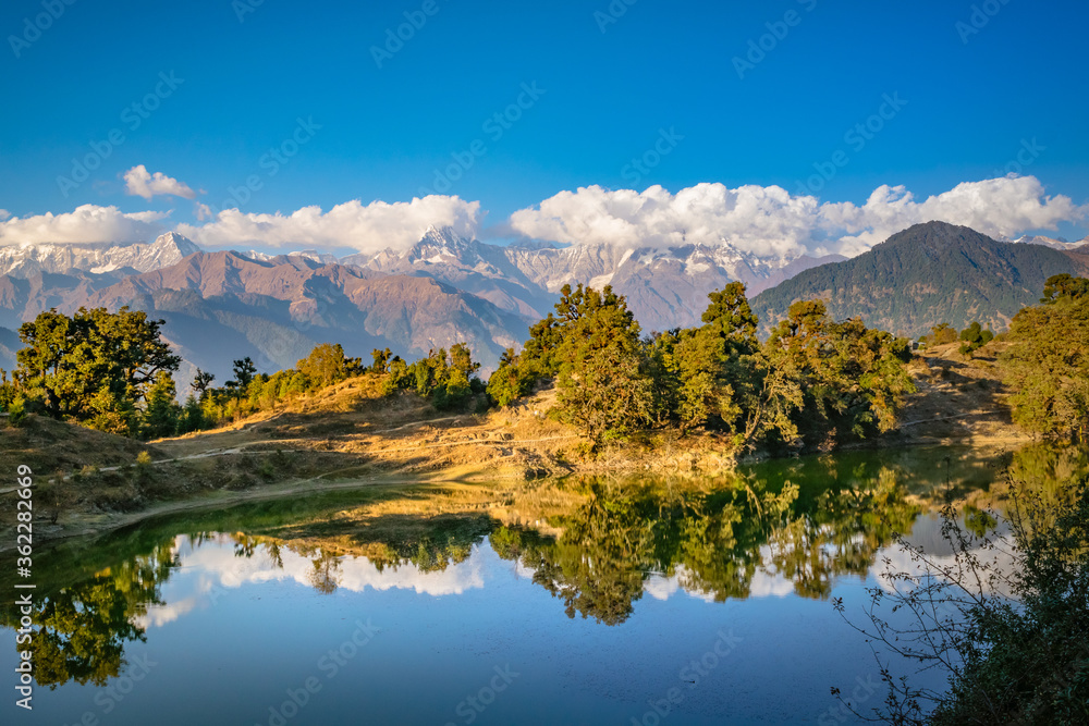 Mesmerizing view at Deoria Tal or Lake nestled in Garhwal Himalayas at  Chopta, Uttarakhand, India. This lake is a camping location for Tungnath Chandrashila hiking trail.