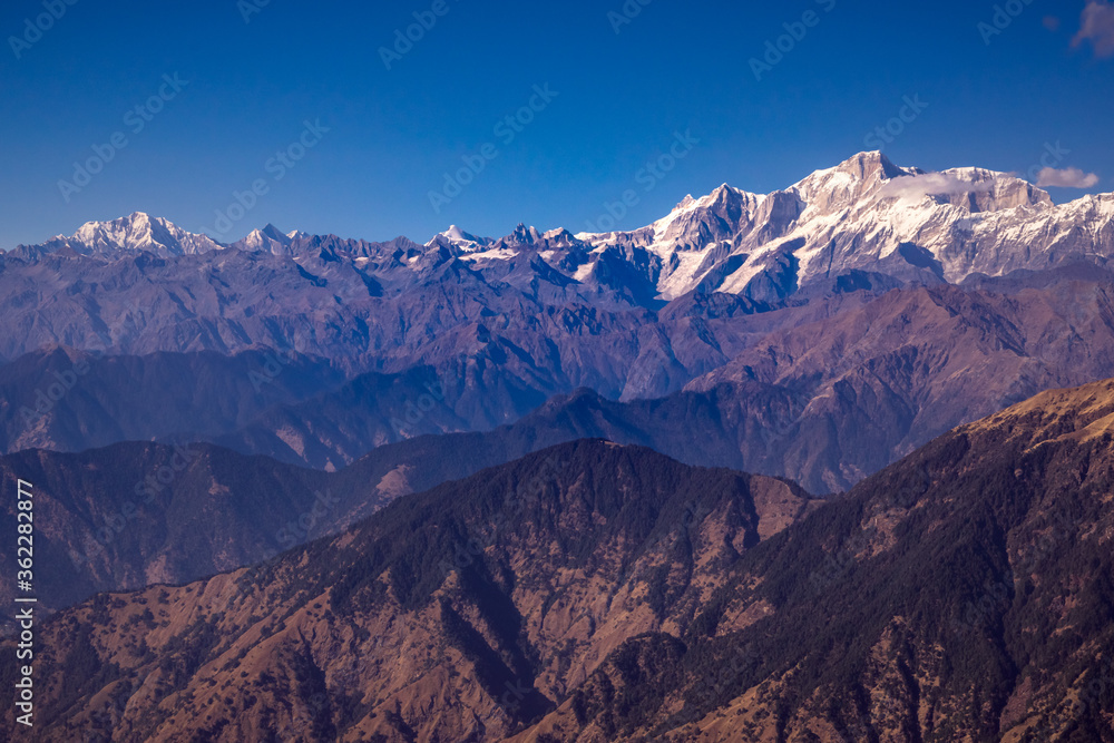 Panoramic view Himalayan mountains view from Chandrashila summit, Chopta. Chandrashila is a peak in the Himalayan ranges in Uttarakhand state of India. It lies at an altitude of 12,083 ft from the sea