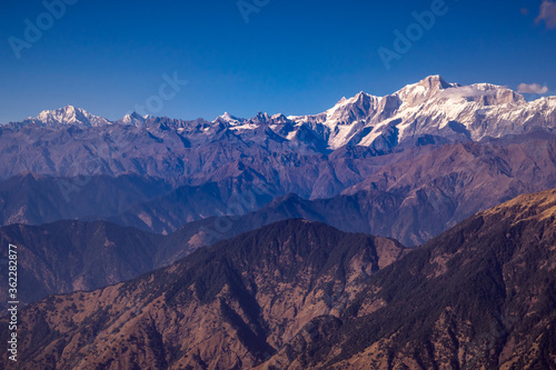 Panoramic view Himalayan mountains view from Chandrashila summit, Chopta. Chandrashila is a peak in the Himalayan ranges in Uttarakhand state of India. It lies at an altitude of 12,083 ft from the sea © anjali04