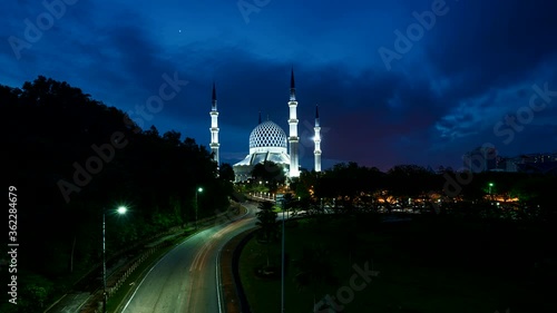 Sunset time lapse at the Abdul Aziz Shah Moschee at Shah Alam, Selangor, Malaysia near Kuala Lumpur. Colorful spectacular sunset timelapse on a mosque at the klang valley Malaysia
