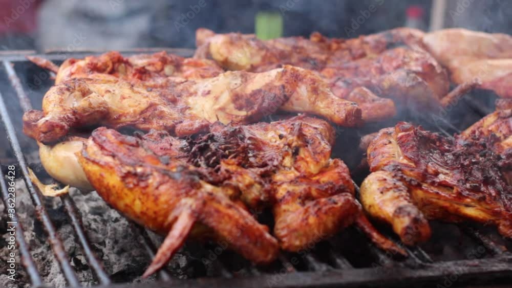 closeup to chicken being grilled roasted closeup to chicken being grilled roasted