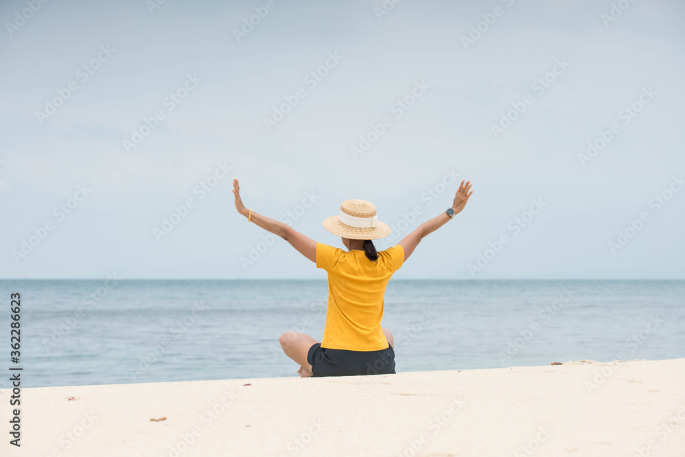 happy time woman yellow shirt happy and relax on the beach happy time woman yellow shirt happy and relax on the beach