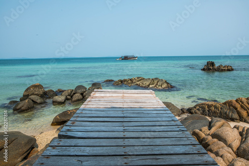 A wooden bridge protruding into the sea