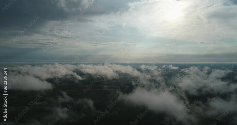 Green fields of aerial view can be seen through the clouds. Agroindustry Ukraine Rivne Green fields of aerial view can be seen through the clouds. Agroindustry Ukraine Rivne