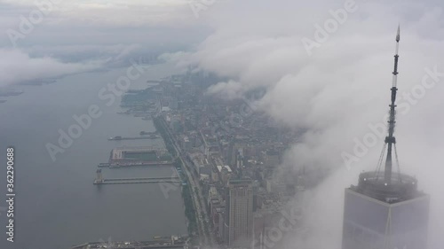 4K RAW Footage in D-log: Aerial view of One World Trade Center above the cloud, WTC 1, New York City Skyline / Cityscape at cloudy day. 