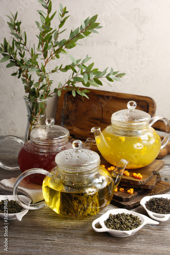 Different varieties of tea in glass teapots 