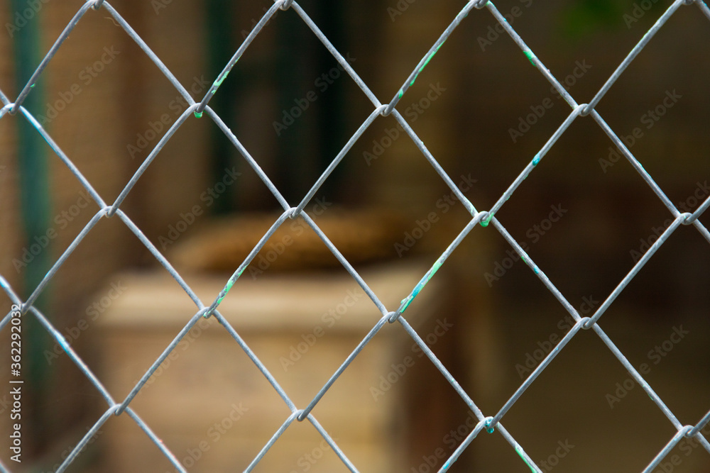 Mesh cage fence with wire behind, marine concept Mesh cage fence with wire behind, marine concept