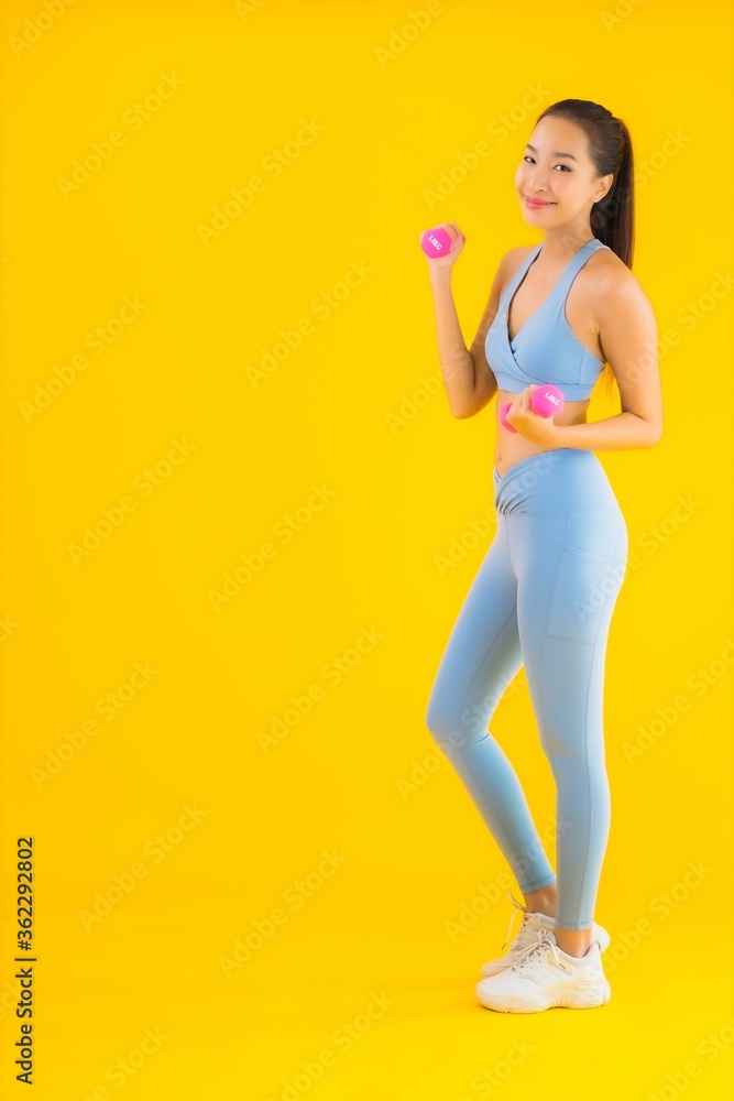 Portrait beautiful young asian woman with dumbbell and sportwear Portrait beautiful young asian woman with dumbbell and sportwear