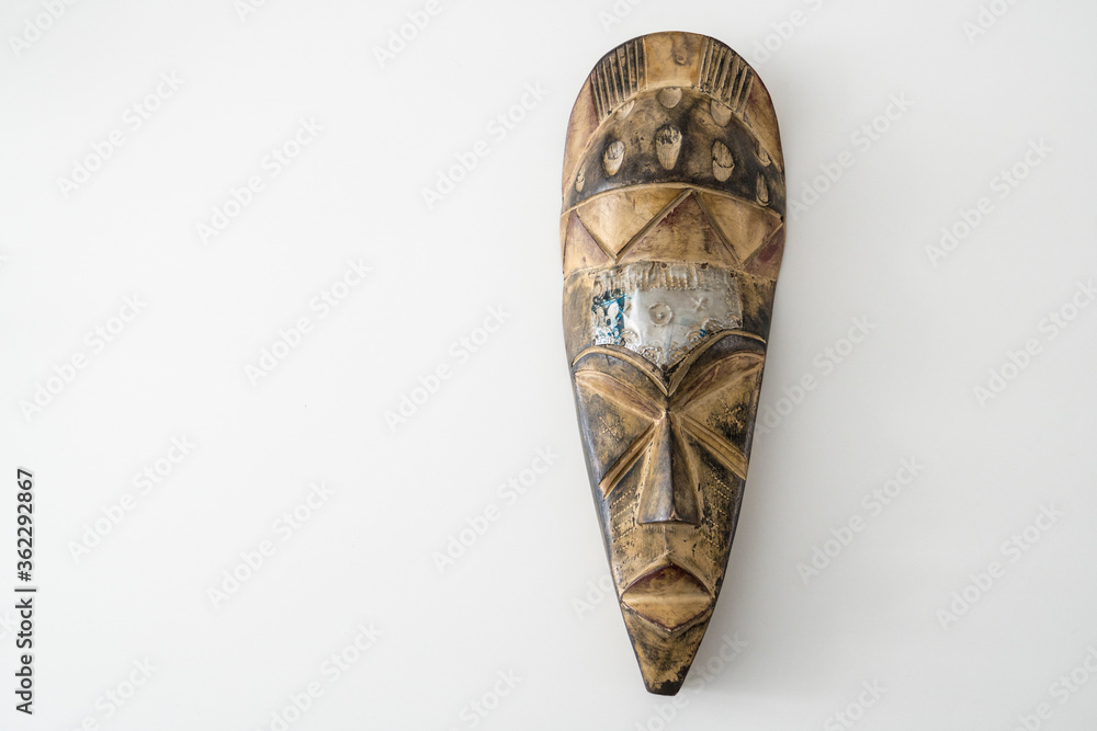 İsolated on white background wooden mask,space for writing İsolated on white background wooden mask,space for writing