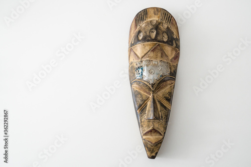 İsolated on white background wooden mask,space for writing