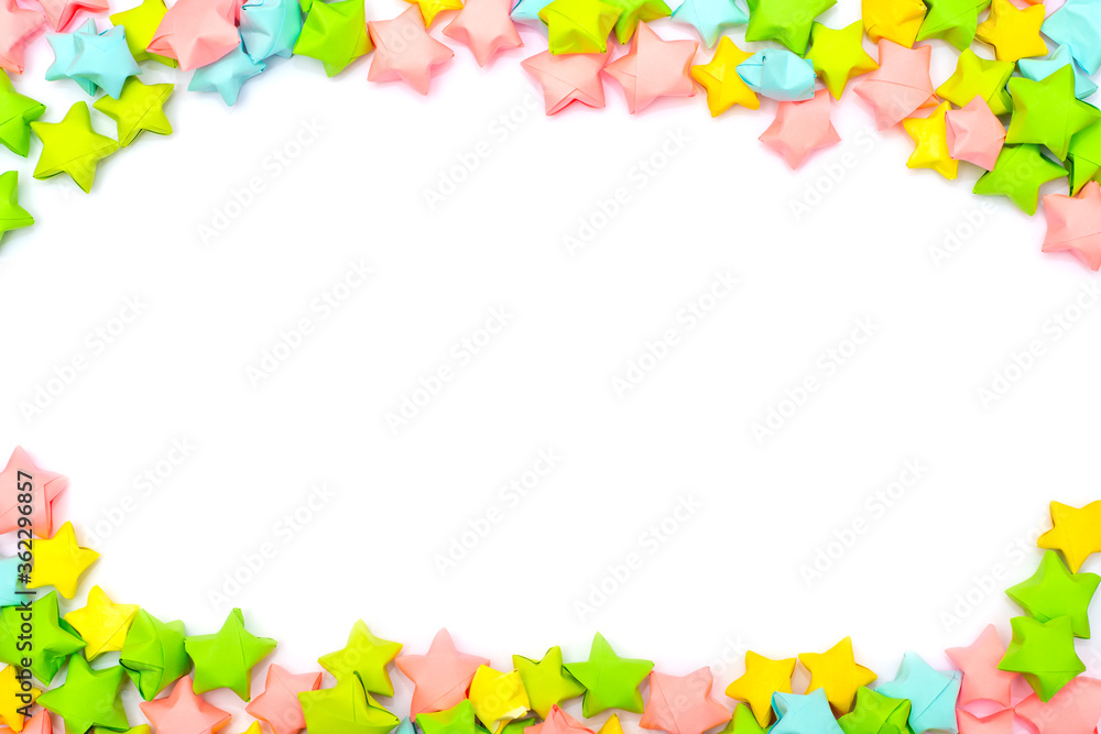 Frame of colorful paper stars in a children's style with an empty white place for text or image in the center Frame of colorful paper stars in a children's style with an empty white place for text or image in the center