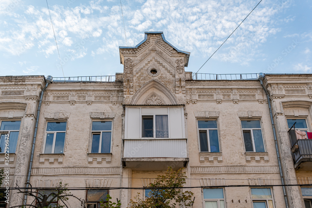 Kyiv (Kiev), Ukraine - July 04, 2020: An ugly plastic balcony on a pre-revolutionary building