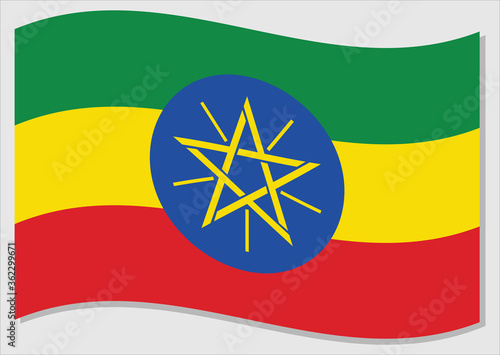 Waving flag of Ethiopia vector graphic. Waving Ethiopian flag illustration. Ethiopia country flag wavin in the wind is a symbol of freedom and independence.