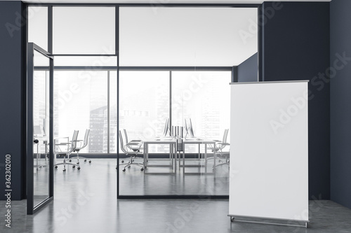 Panoramic grey open space office with poster