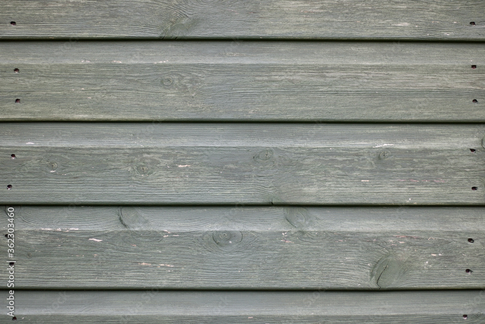 Obraz premium Grooved weathered wooden background with nail holes and space for copy