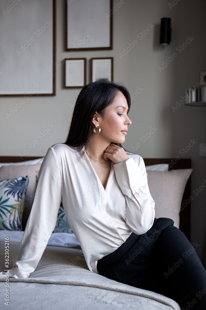 Young woman have a rest in a modern bright and cozy apartments, scandinavian style. Lifestyle, care and relaxation Young woman have a rest in a modern bright and cozy apartments, scandinavian style. Lifestyle, care and relaxation