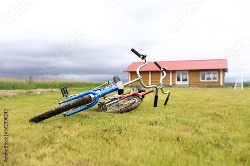View of two bicycles lying on lawn