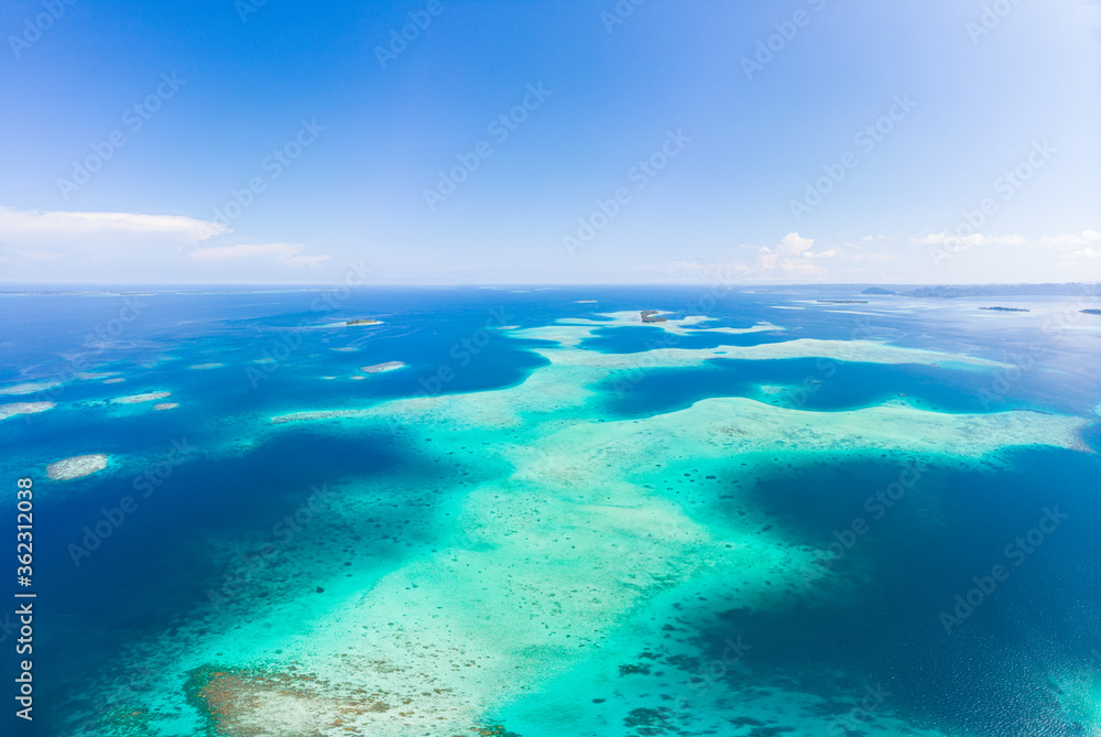 Aerial: exotic tropical coral reef secluded destination away from it all, caribbean sea turquoise water white sand beach. Indonesia Sumatra Banyak islands Aerial: exotic tropical coral reef secluded destination away from it all, caribbean sea turquoise water white sand beach. Indonesia Sumatra Banyak islands