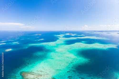 Aerial: exotic tropical coral reef secluded destination away from it all, caribbean sea turquoise water white sand beach. Indonesia Sumatra Banyak islands © fabio lamanna