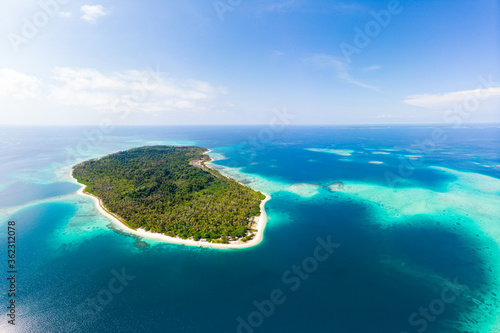 Fototapeta Naklejka Na Ścianę i Meble -  Aerial: exotic tropical island secluded destination away from it all, coral reef caribbean sea turquoise water white sand beach. Indonesia Sumatra Banyak islands
