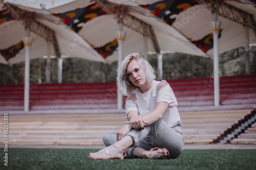 young woman sitting on a bench