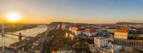 Panoramic aerial drone shot of Buda castle on Buda hill during Budapest sunrise morning glow