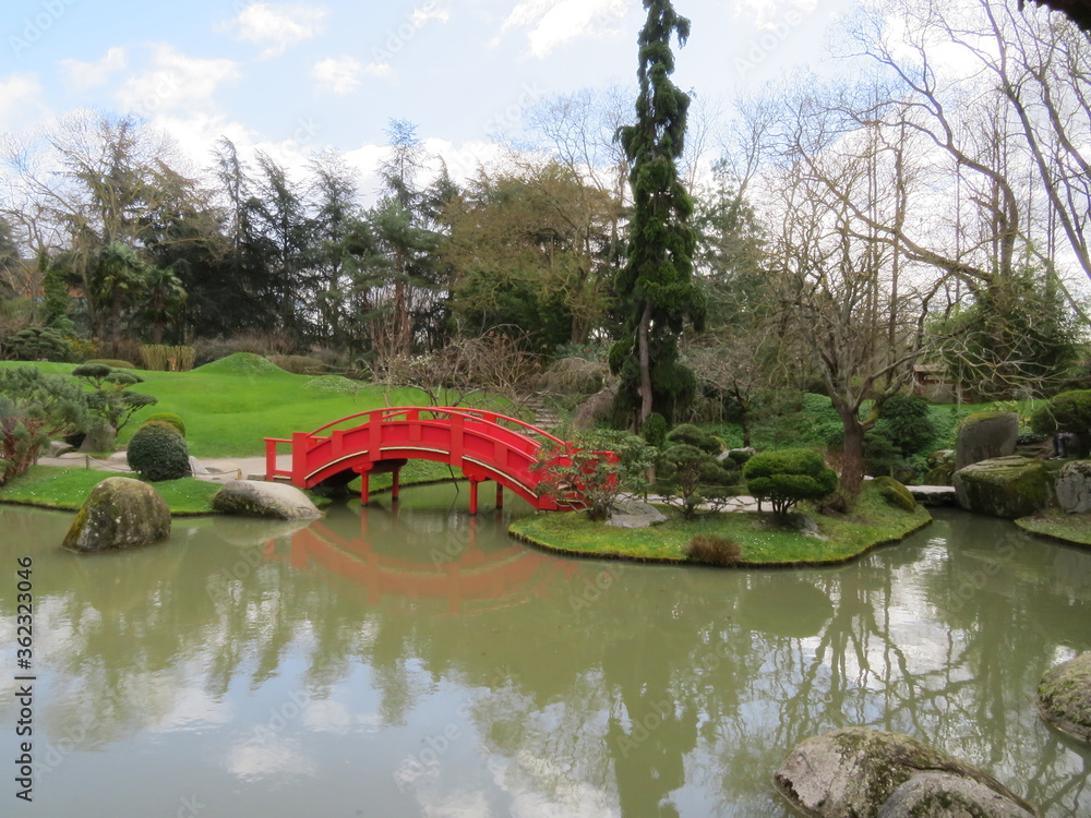 Beautiful Japanese garden in the city of Toulouse with lake and bridge Beautiful Japanese garden in the city of Toulouse with lake and bridge
