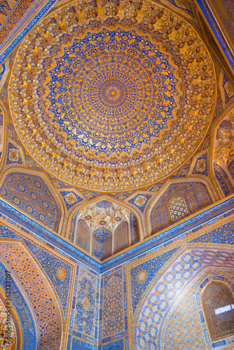 Golden ceiling of Tilya-Kori Madrasa at Registan in Samarkand, Uzbekistan. It is part of the Samarkand - Crossroad of Cultures World Heritage Site.