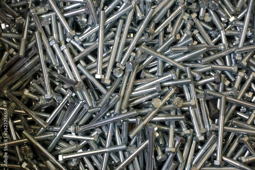 Shining bolts blue toned photo and bolts / background. Industry, metal. are used in construction. Shining bolts blue toned photo and bolts / background. Industry, metal. are used in construction.