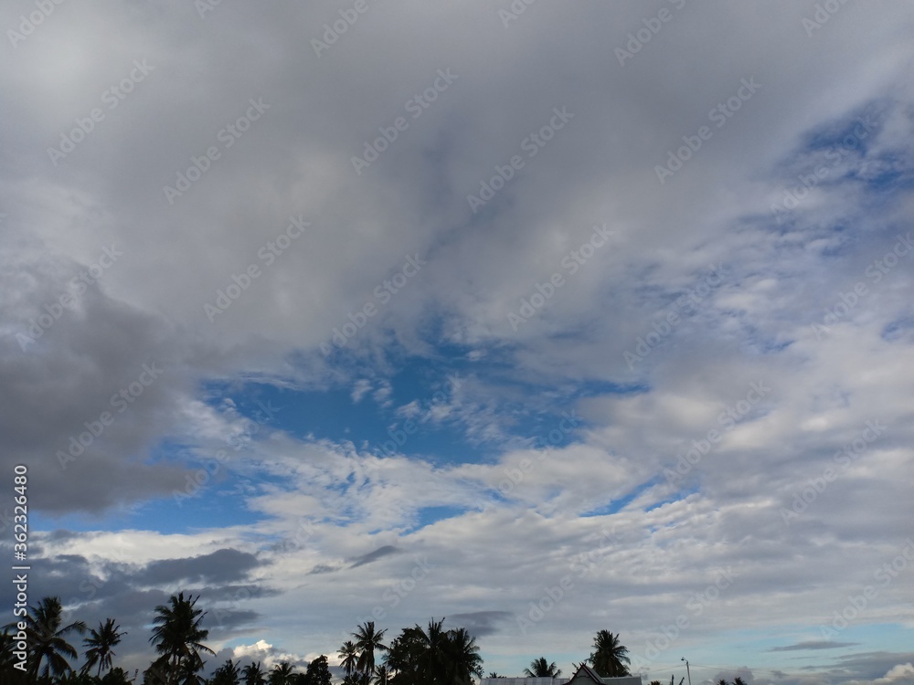 black and white clouds against a background of blue sky black and white clouds against a background of blue sky
