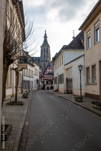 Cobbled road with historic houses and Schlosskirche in Meisenheim