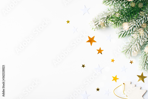 Christmas card with polka dot gift box, green branch, light, garland and stars on white background