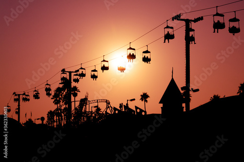 Принти на полотні Santa Cruz Beach Boardwalk, California - Sihouette of Beach Swing Ride at Sunset