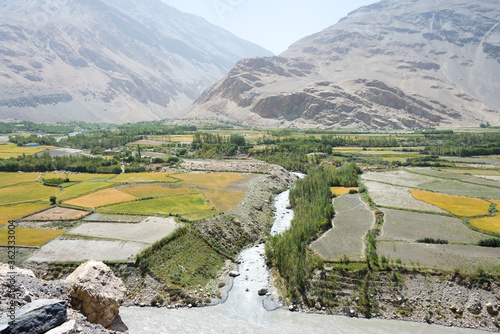 Afghanistan Village at Wakhan Valley View from Khaakha Fortress in Ishkashim, Gorno-Badakhshan, Tajikistan. It is located in the Tajikistan and Afghanistan border. photo