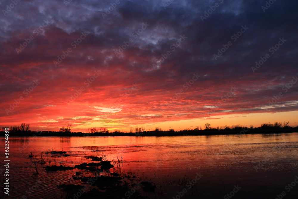 Colorful sunset by the Odra River, Poland.