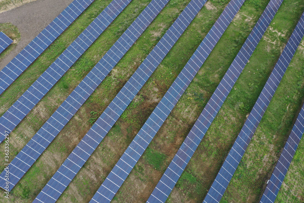 Aerial view of the huge solar power plant. Alternative clean green energy using renewable solar energy. Drone photo Solar panels in Europe, Hungary. Aerial view of the huge solar power plant. Alternative clean green energy using renewable solar energy. Drone photo Solar panels in Europe, Hungary.