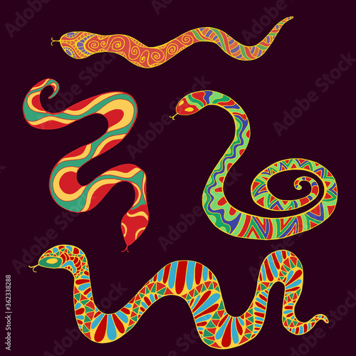 Collection of bright ethnic snakes isolated on dark brown background.