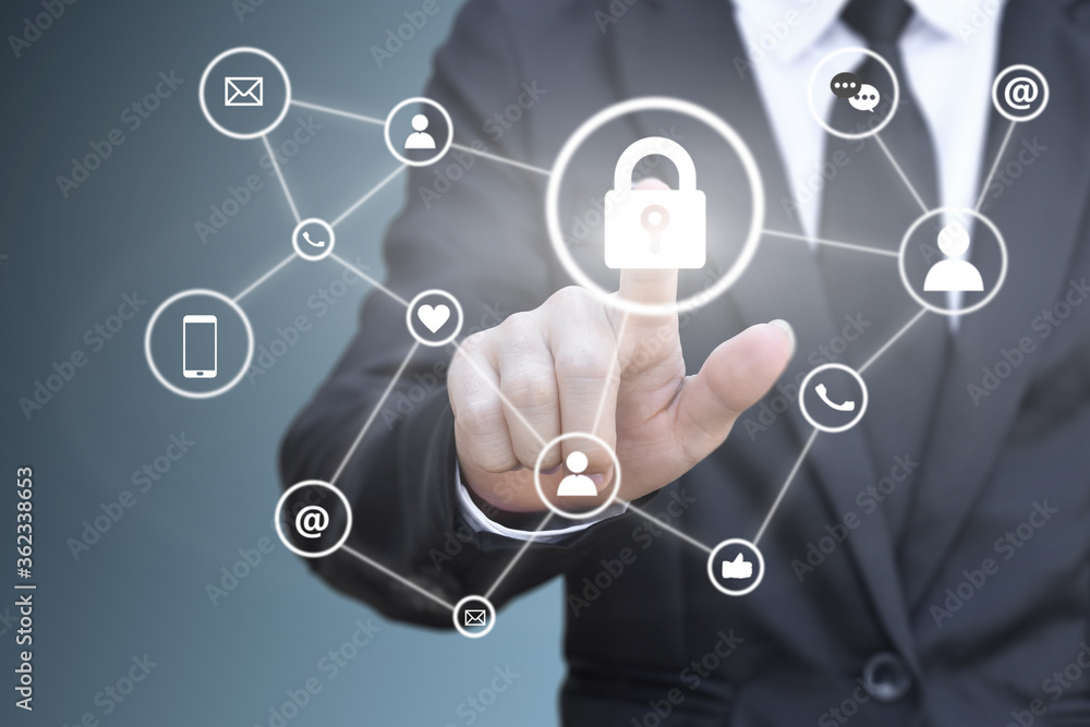 Businessman hand pressing lock icon on virtual screen for social network connection. Concept of personal data security. Businessman hand pressing lock icon on virtual screen for social network connection. Concept of personal data security.